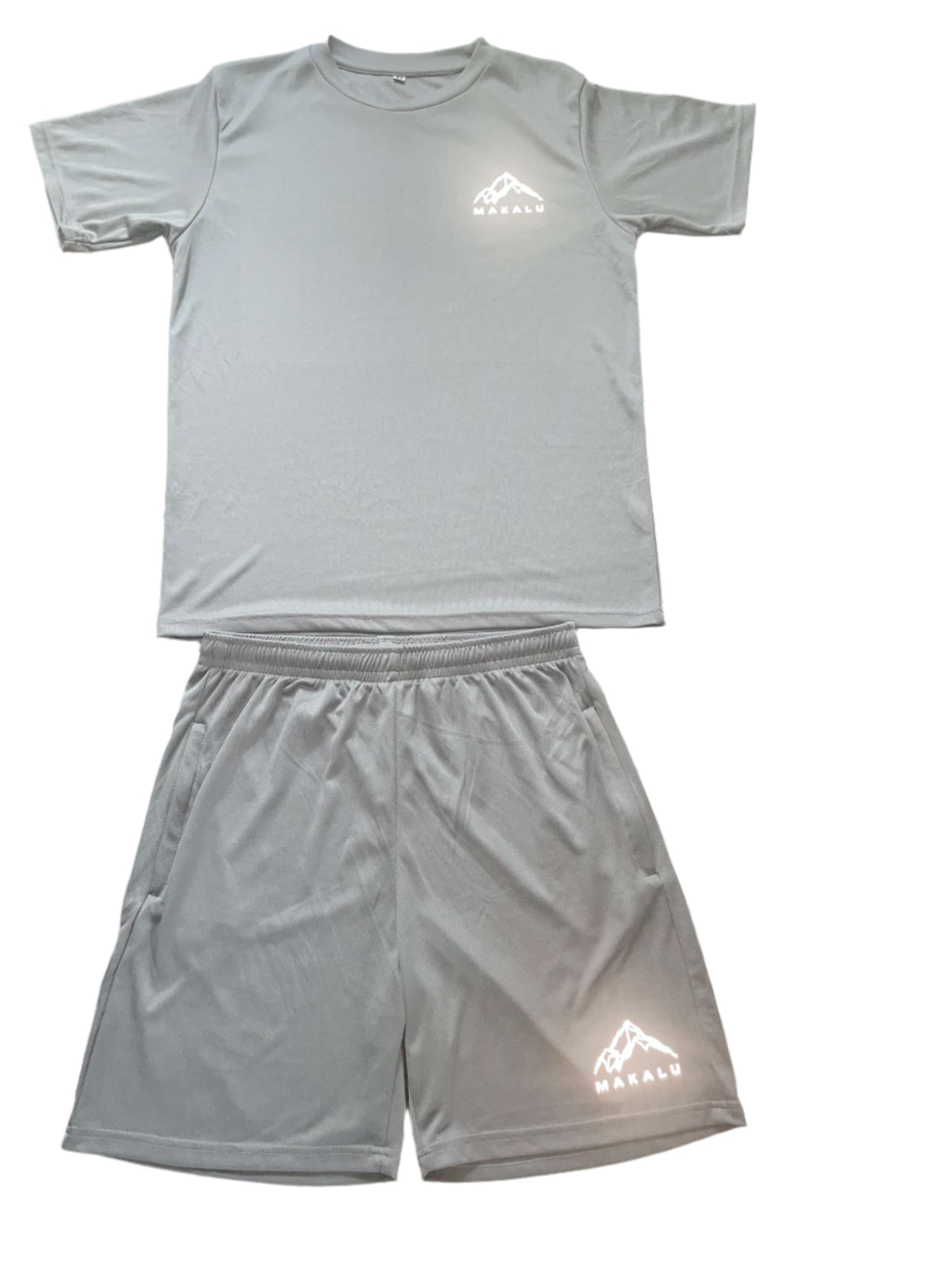 Light gray active fitness t-shirt and shorts set with MaKalu logo on black speckled floor